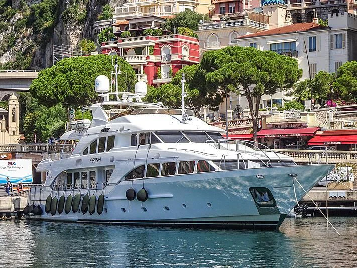 a white boat on the water aboard FRISH Yacht for Sale