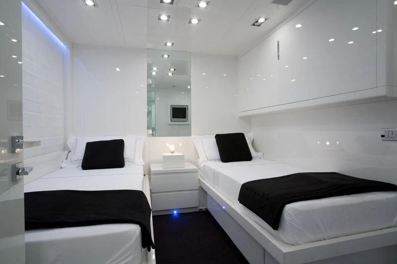 a room with several beds aboard FRISH Yacht for Sale