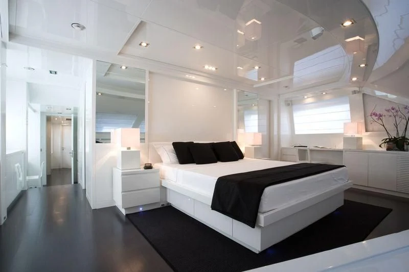 a large bedroom with a large bed aboard FRISH Yacht for Sale
