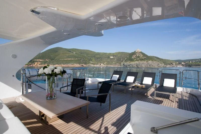 a room with a view of a mountain and a large body of water aboard FRISH Yacht for Sale