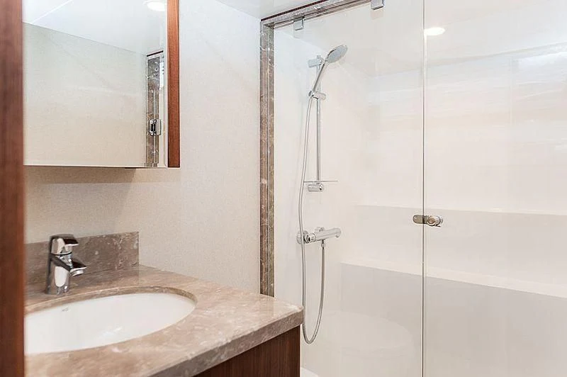a bathroom with a shower and sink aboard VARIABLE Yacht for Sale