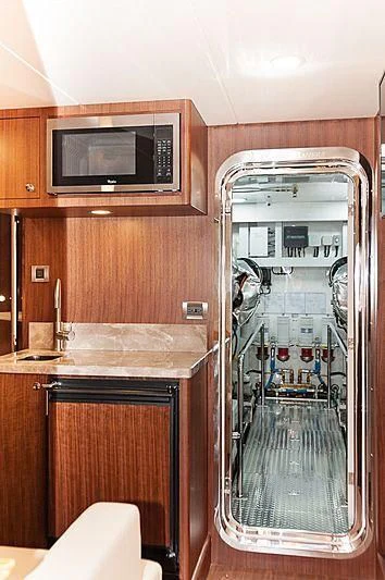 a kitchen with a glass door aboard VARIABLE Yacht for Sale