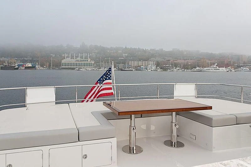 a table with a flag on it aboard VARIABLE Yacht for Sale