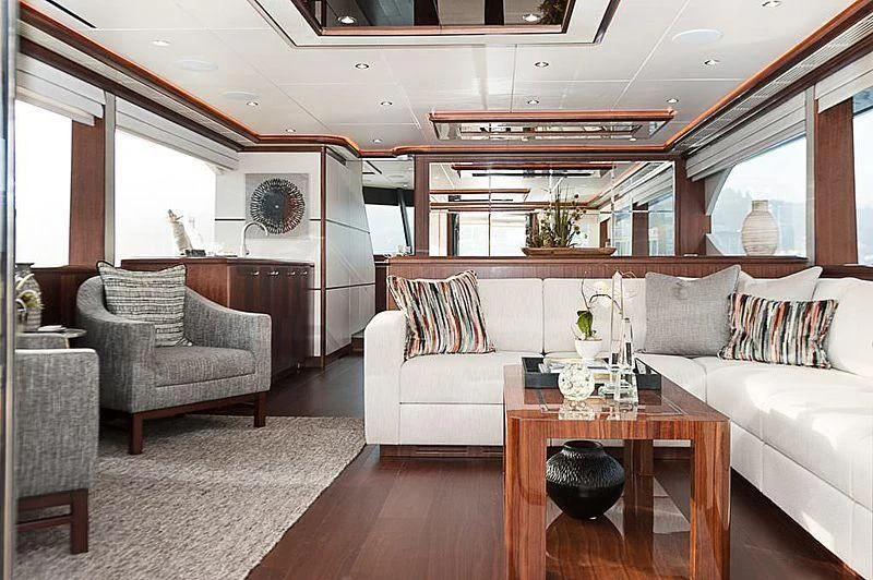a living room with a couch and a coffee table aboard VARIABLE Yacht for Sale