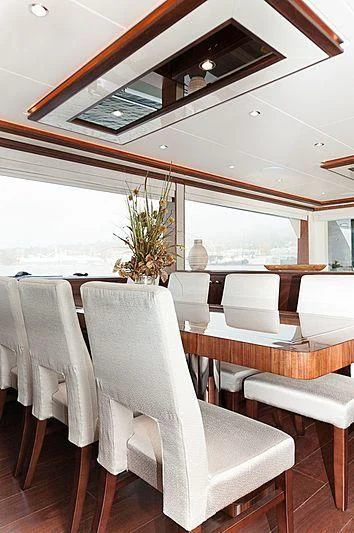 a room with a table and chairs aboard VARIABLE Yacht for Sale