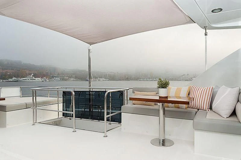 a room with a table and chairs aboard VARIABLE Yacht for Sale