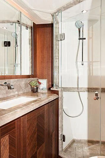 a bathroom with a shower and sink aboard VARIABLE Yacht for Sale