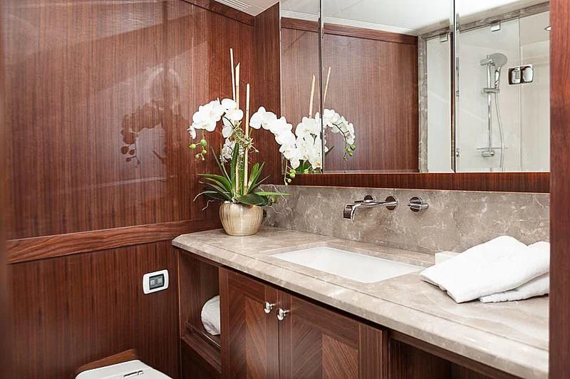 a bathroom with a countertop sink and mirror aboard VARIABLE Yacht for Sale