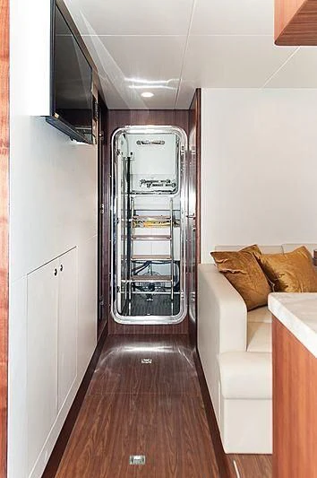 a room with a bed and a couch aboard VARIABLE Yacht for Sale