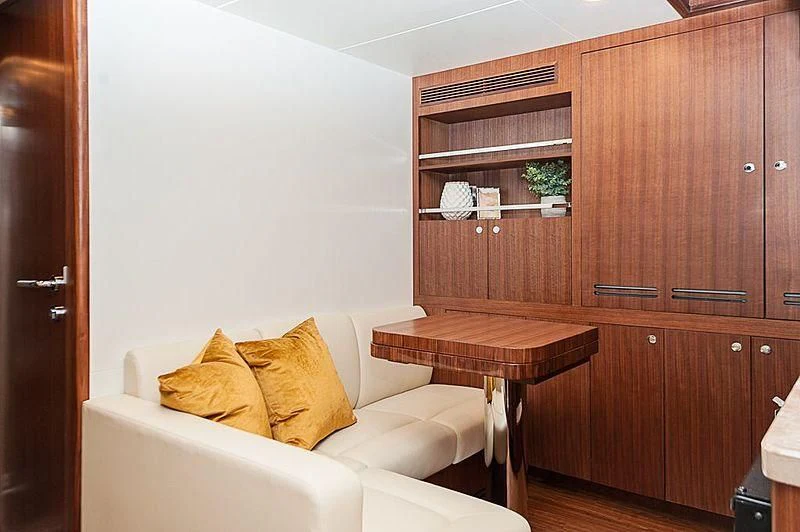 a room with a couch and a table aboard VARIABLE Yacht for Sale