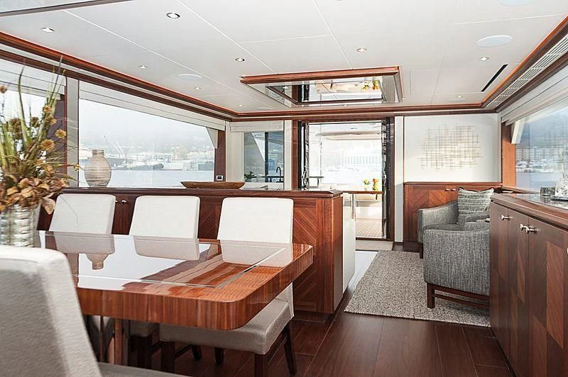 a large room with a table and chairs aboard VARIABLE Yacht for Sale