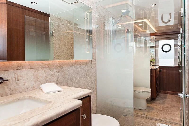 a bathroom with a glass shower aboard VARIABLE Yacht for Sale
