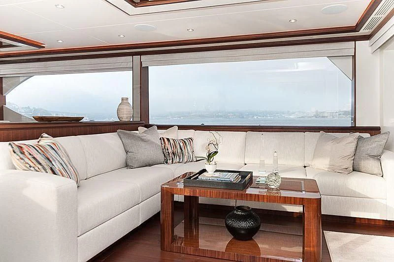 a living room with a couch and a coffee table aboard VARIABLE Yacht for Sale