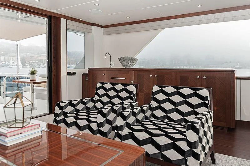 a bedroom with a bed and a table aboard VARIABLE Yacht for Sale