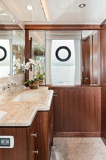 a bathroom with a sink and a mirror aboard VARIABLE Yacht for Sale