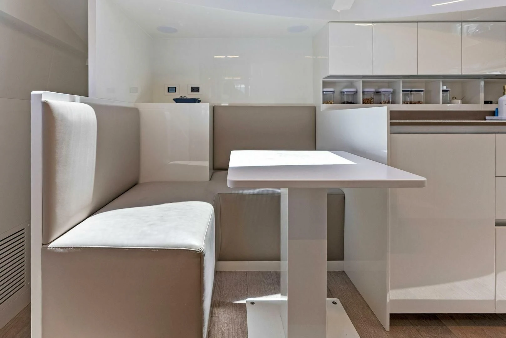 a room with a table and chairs aboard INEA Yacht for Sale