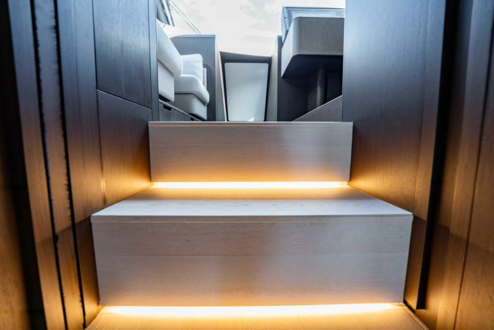 a set of stairs leading up to a set of chairs aboard INEA Yacht for Sale