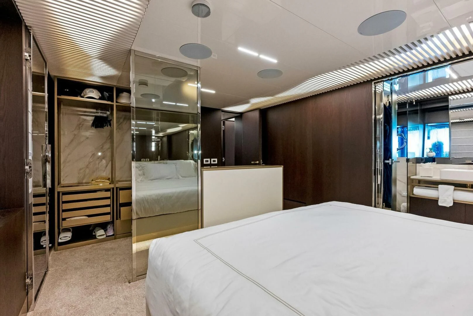 a room with a bed and a closet aboard INEA Yacht for Sale