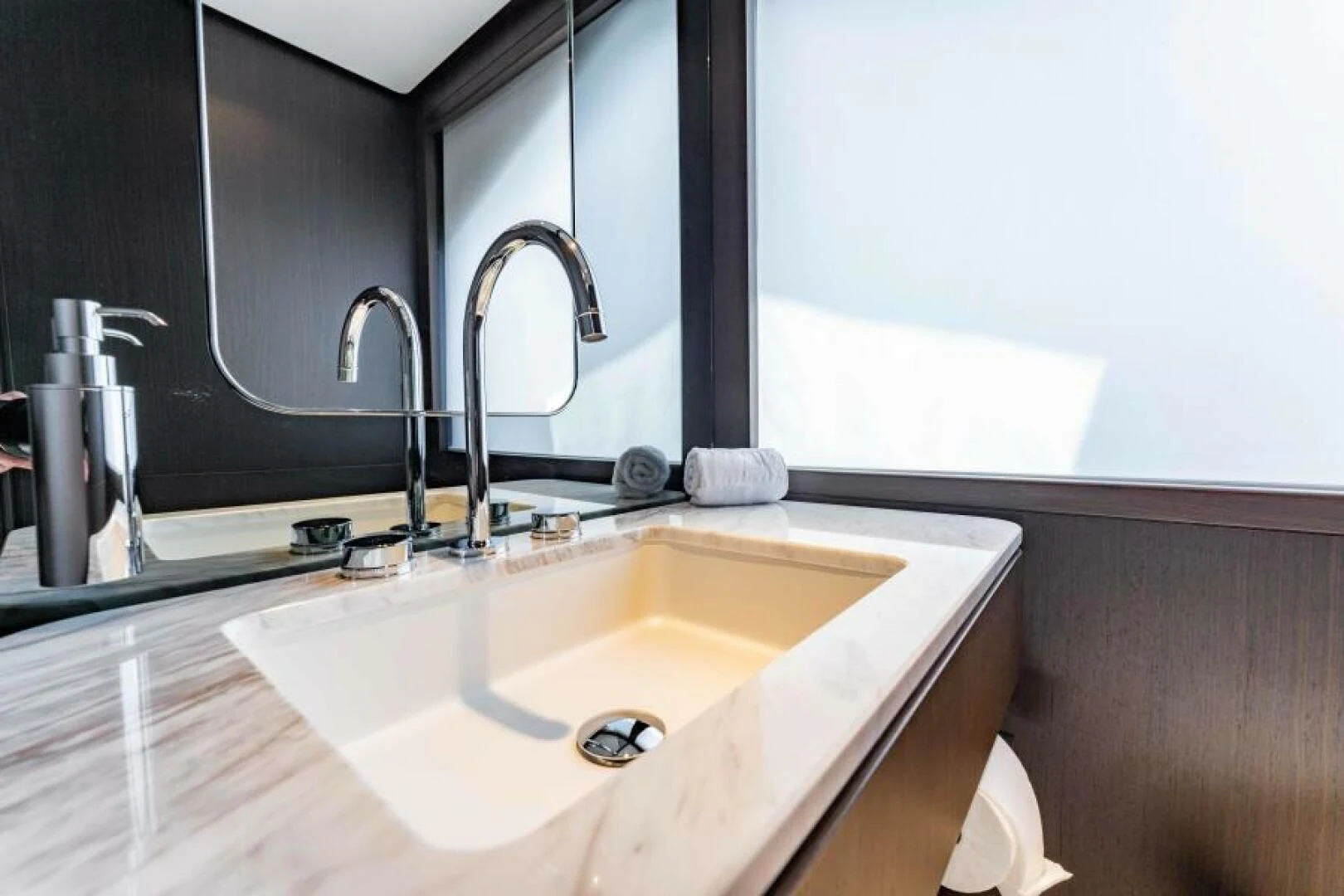 a bathroom with a sink and a mirror aboard INEA Yacht for Sale
