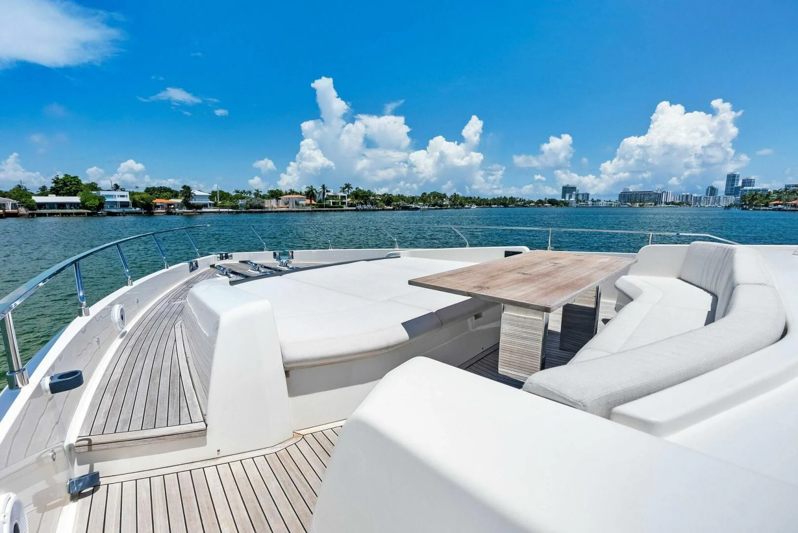 a deck with a view of a city and water aboard INEA Yacht for Sale