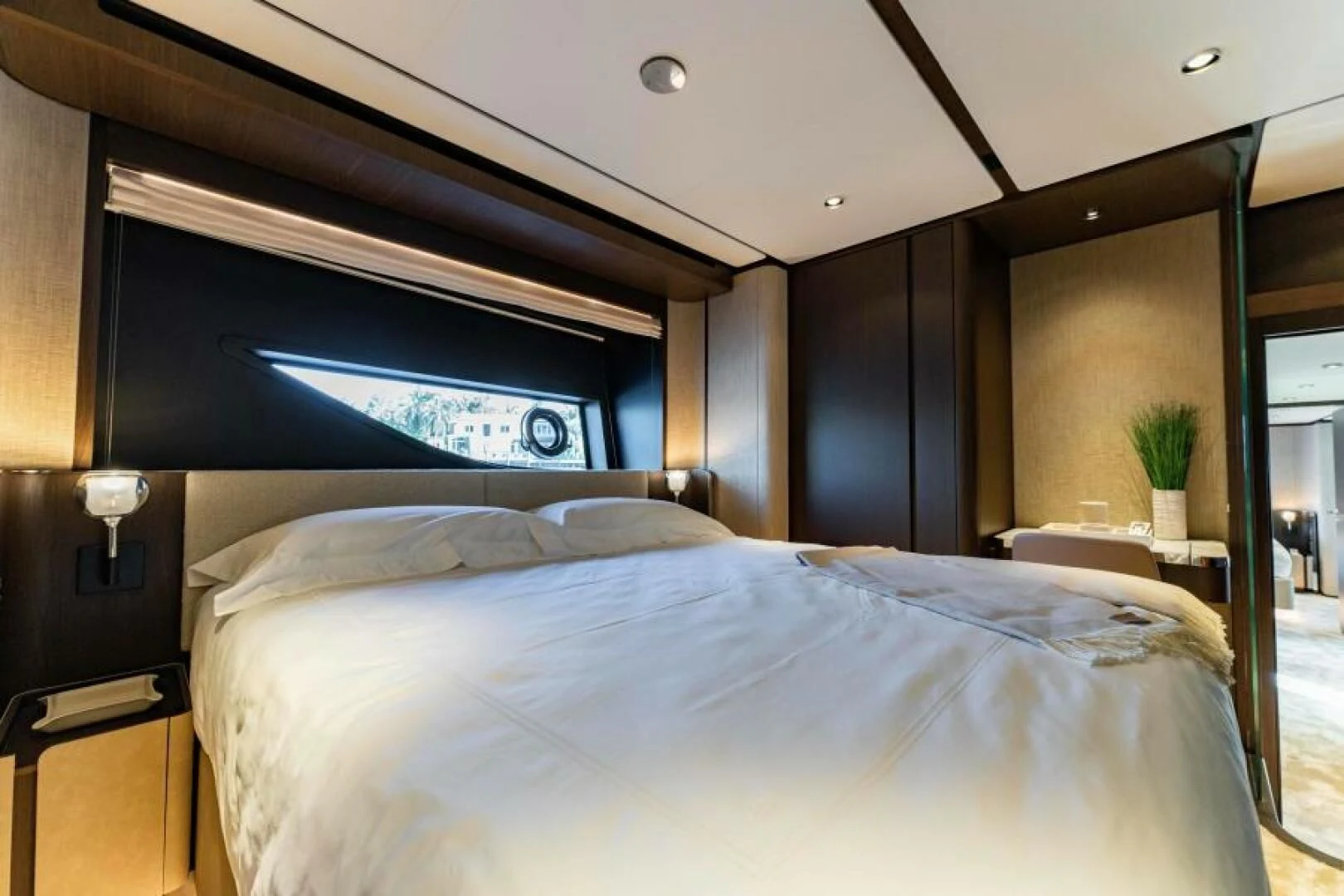 a bed with a large screen aboard INEA Yacht for Sale