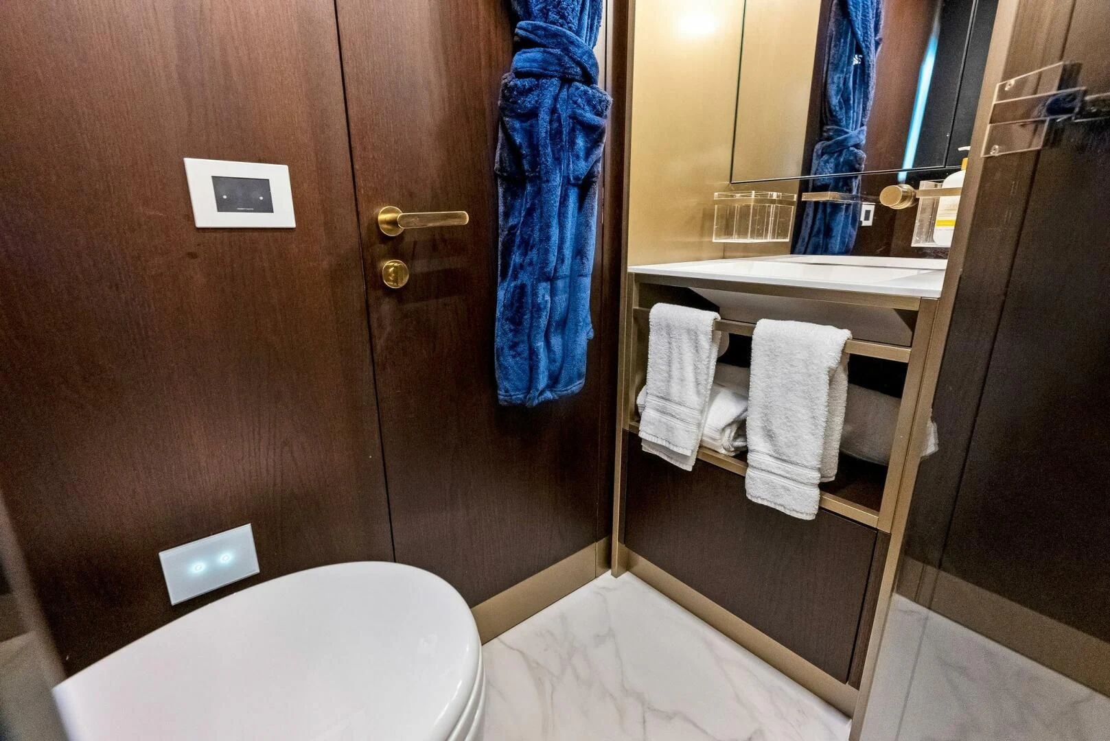 a bathroom with a toilet and a sink aboard INEA Yacht for Sale