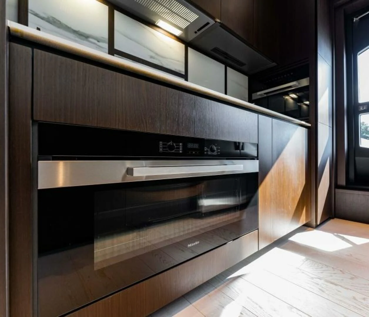 a kitchen with a steel oven aboard INEA Yacht for Sale