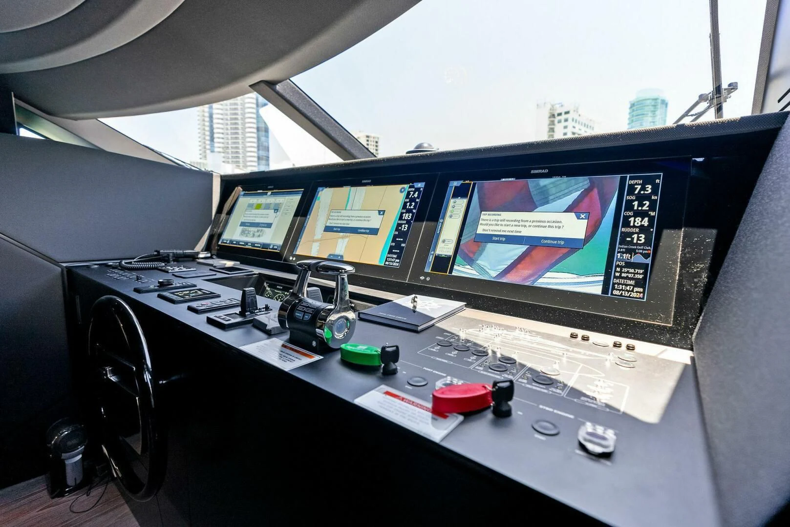 a control panel with a monitor and other electronics on it aboard INEA Yacht for Sale
