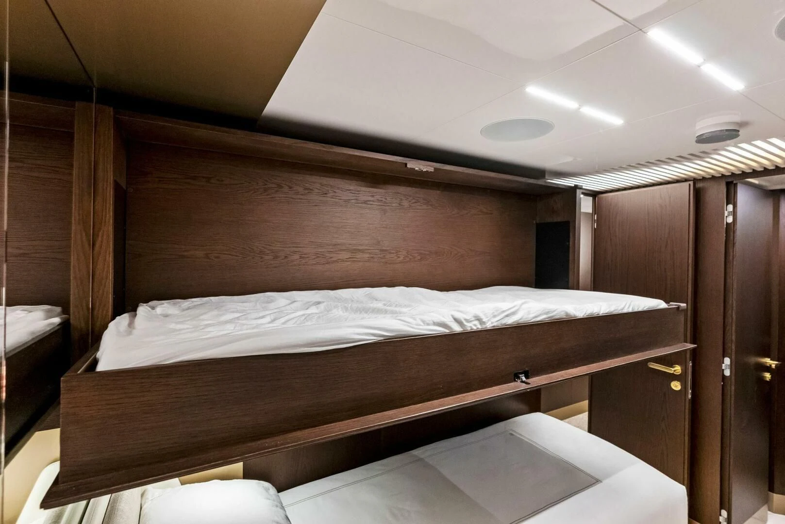 a bed with a wooden headboard aboard INEA Yacht for Sale