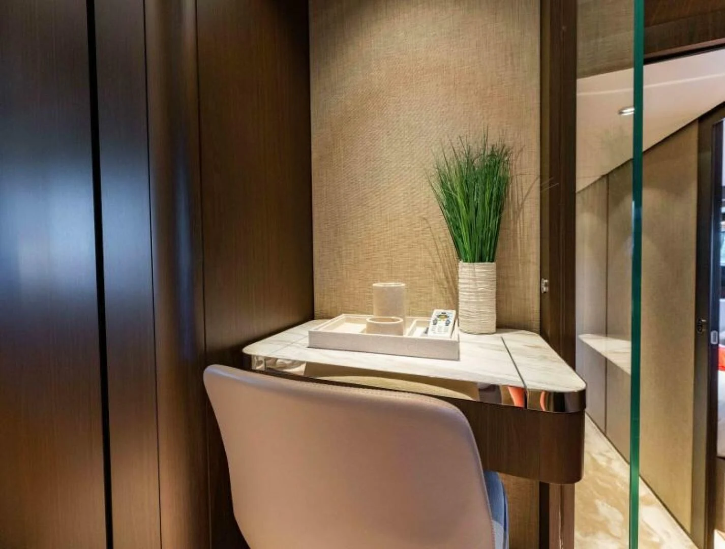 a chair and a desk in a room aboard INEA Yacht for Sale