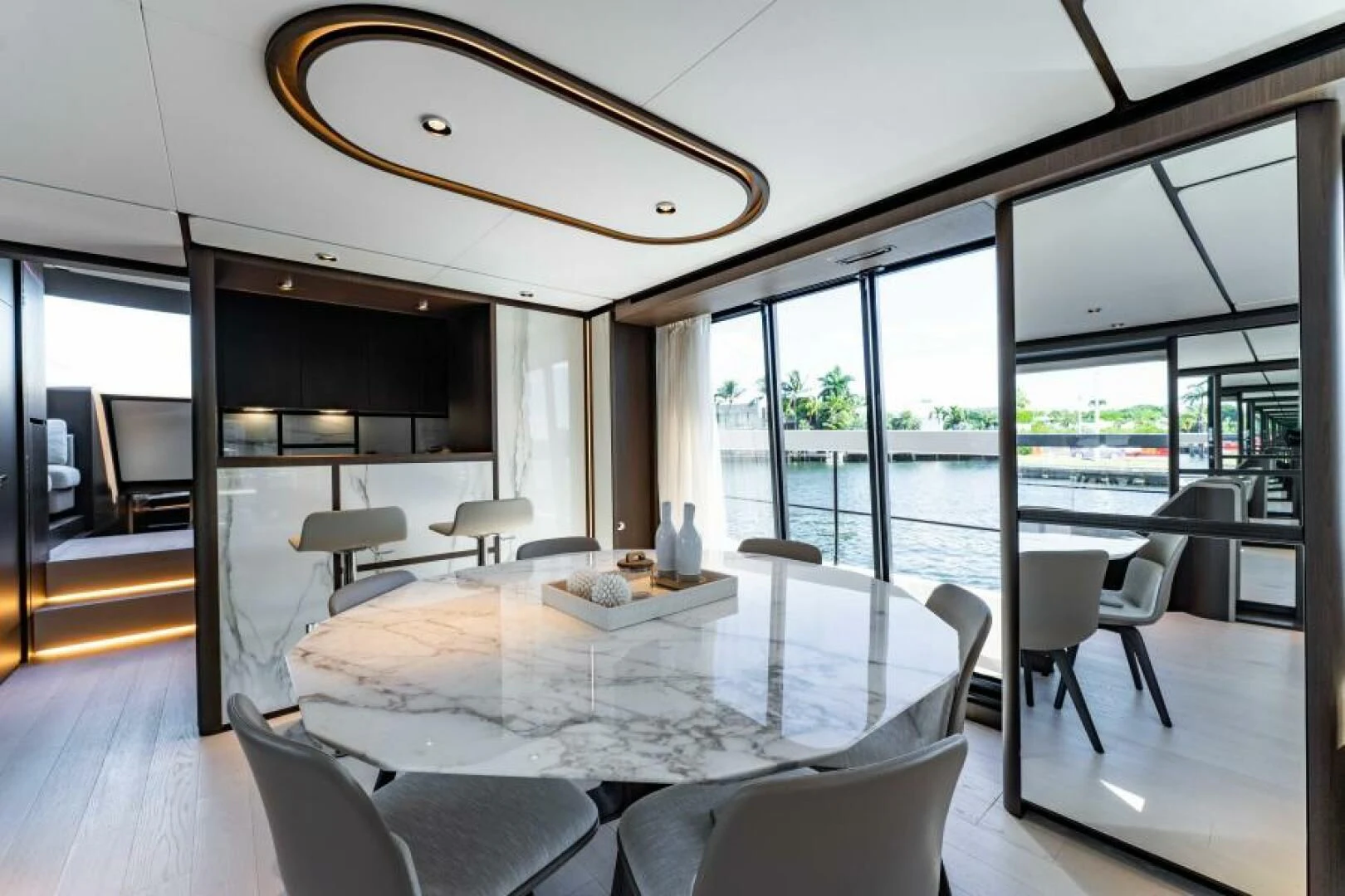 a large room with a large table and chairs aboard INEA Yacht for Sale
