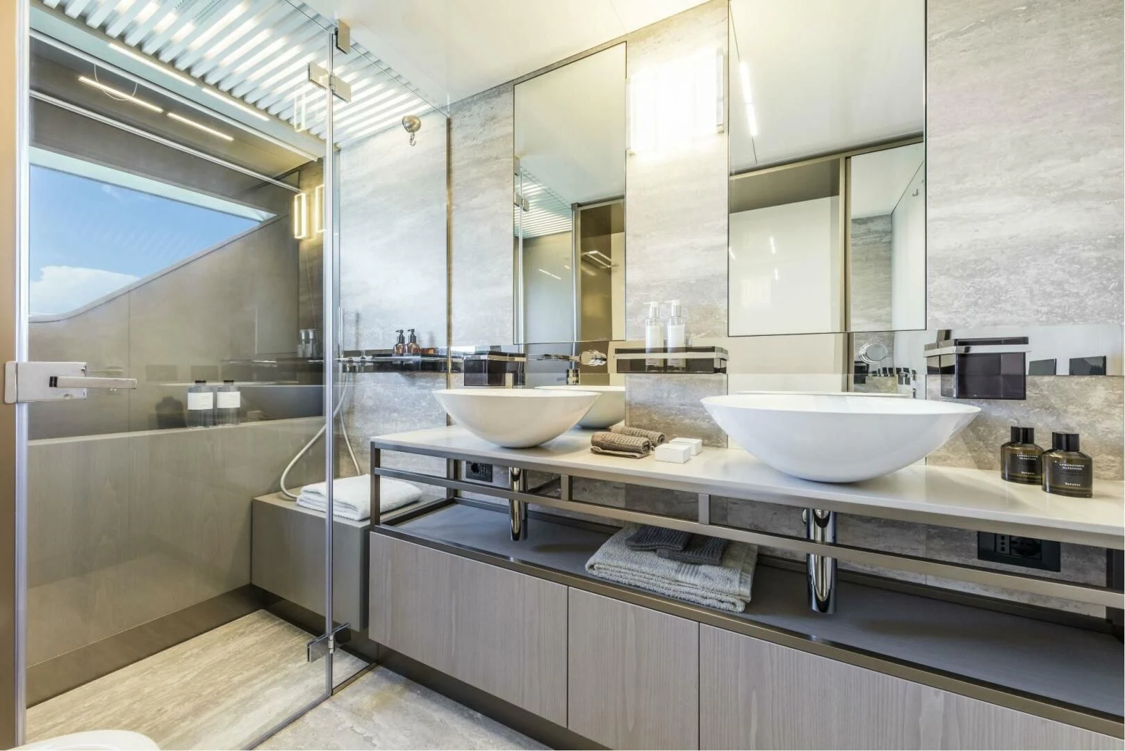 a bathroom with a large mirror aboard INEA Yacht for Sale
