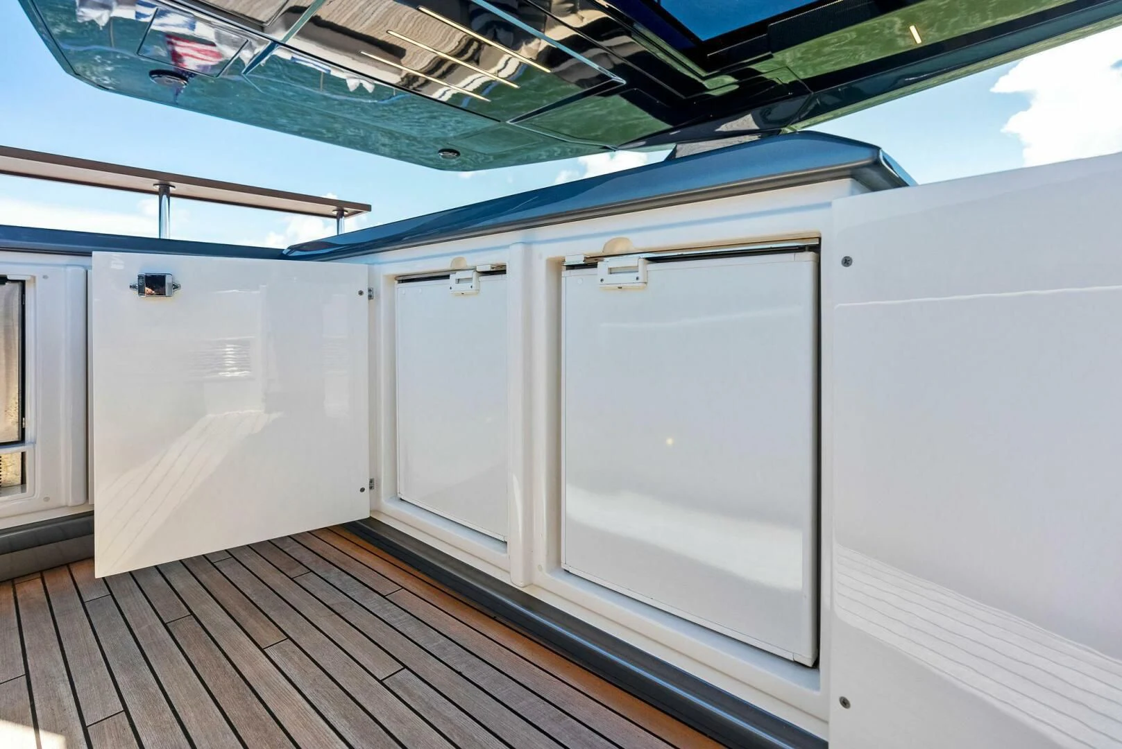 a room with a couple of white doors and a wood floor aboard INEA Yacht for Sale