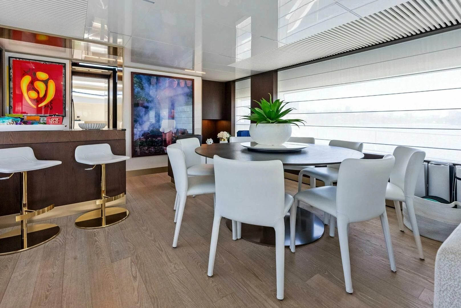 a room with a table and chairs aboard INEA Yacht for Sale