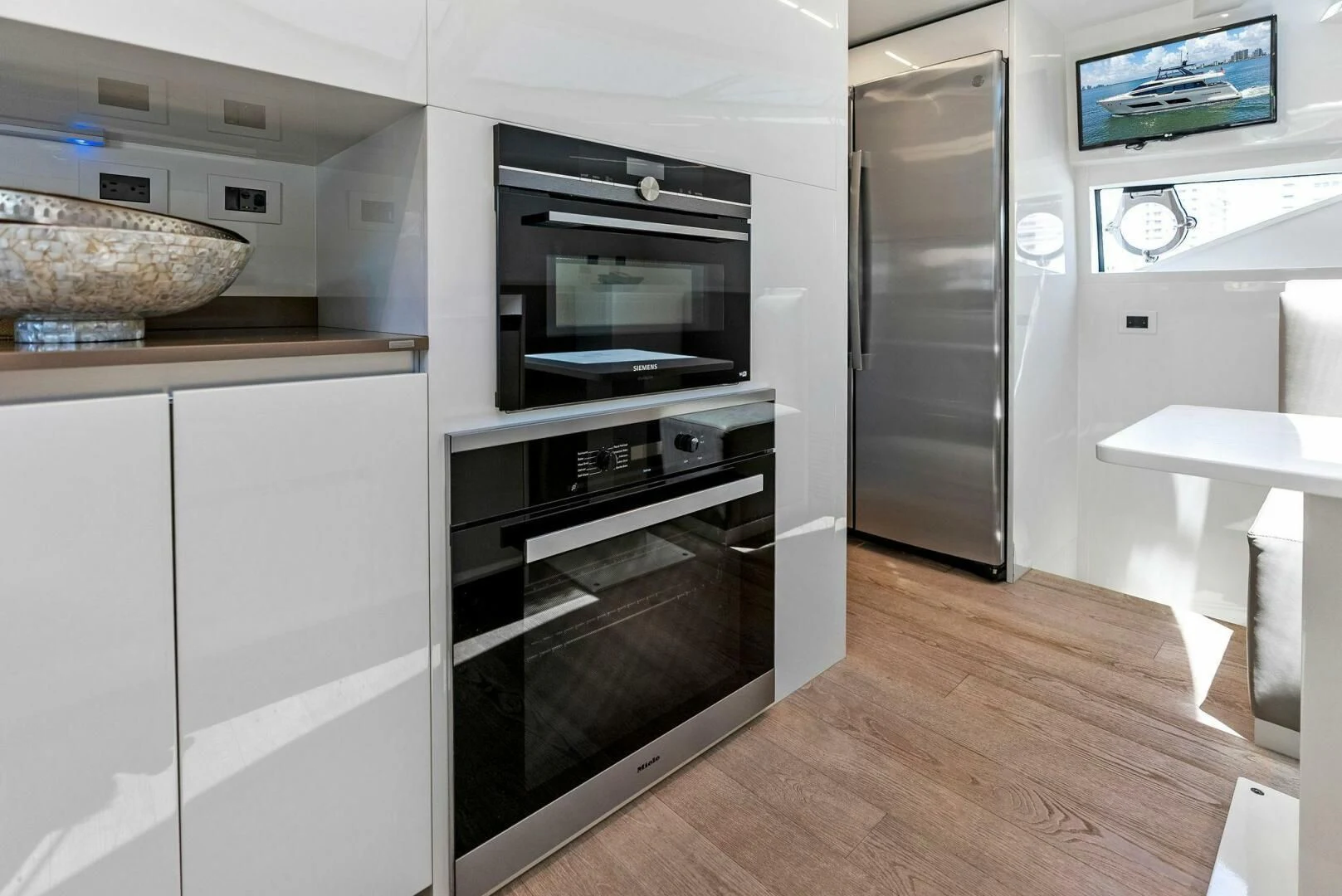 a kitchen with a stove and oven aboard INEA Yacht for Sale