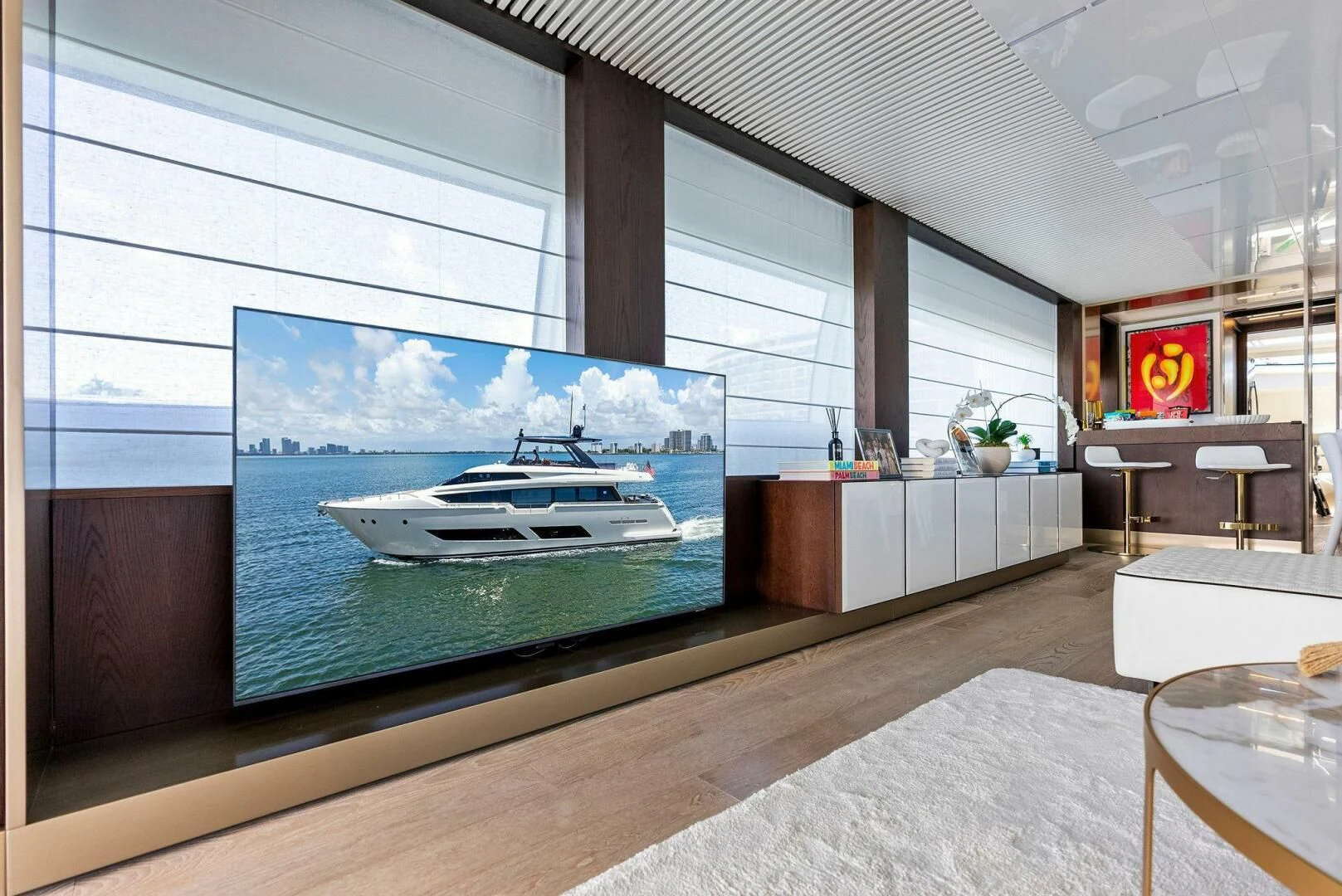 a large room with a large screen aboard INEA Yacht for Sale