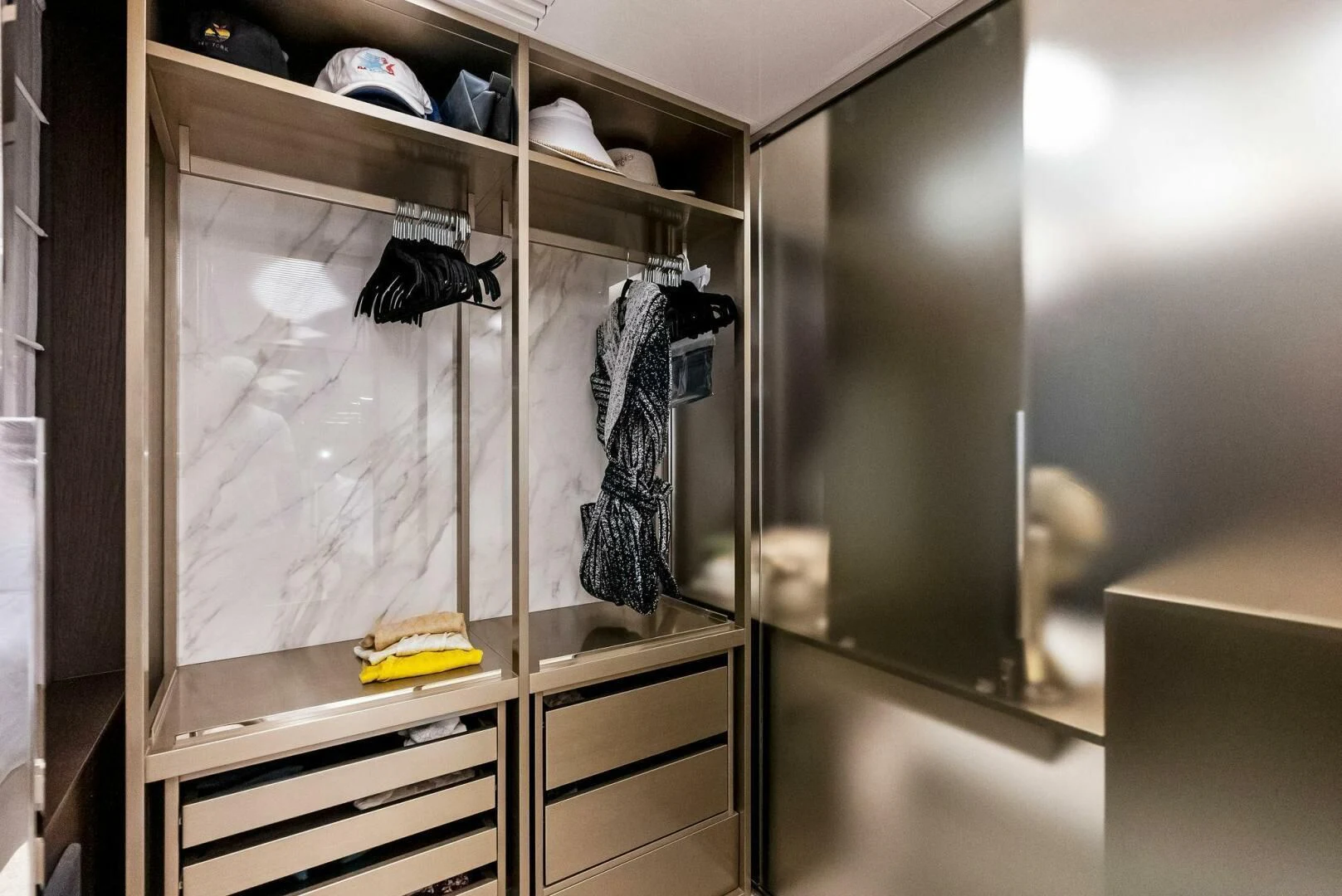 a shelf with clothes on it aboard INEA Yacht for Sale