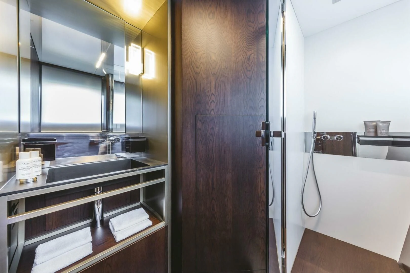 a kitchen with a wood door aboard INEA Yacht for Sale