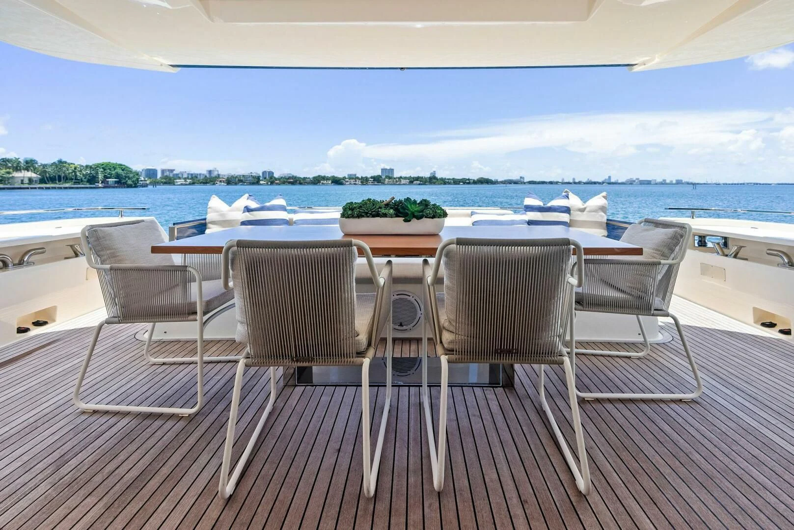 a table and chairs on a deck aboard INEA Yacht for Sale