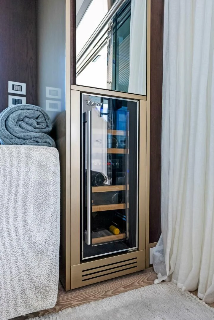 a glass cabinet in a room aboard INEA Yacht for Sale