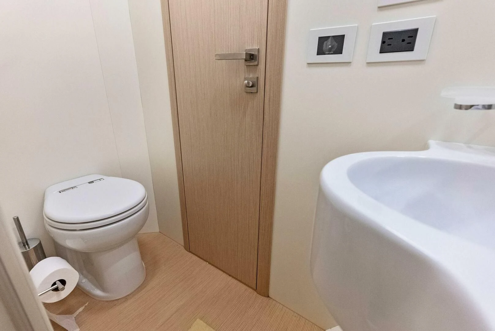 a bathroom with a toilet and sink aboard INEA Yacht for Sale
