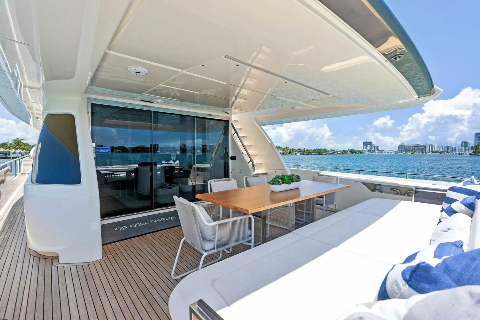 a room with a table and chairs aboard INEA Yacht for Sale
