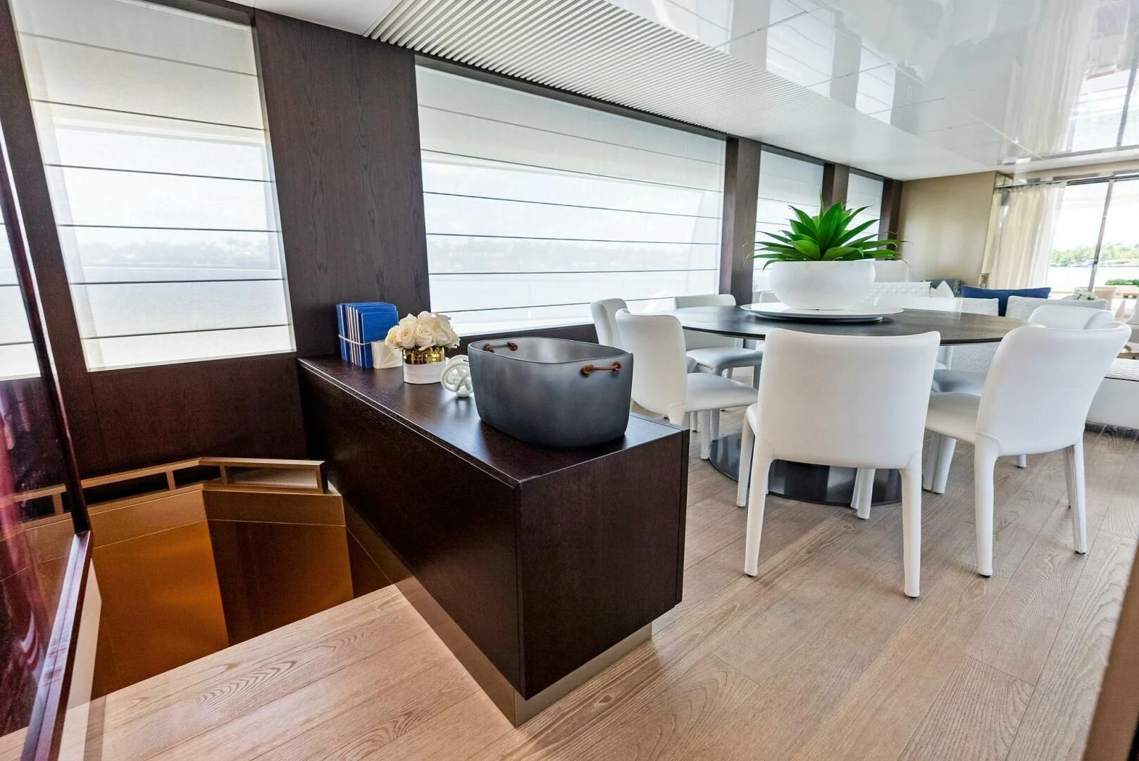 a kitchen with a table and chairs aboard INEA Yacht for Sale