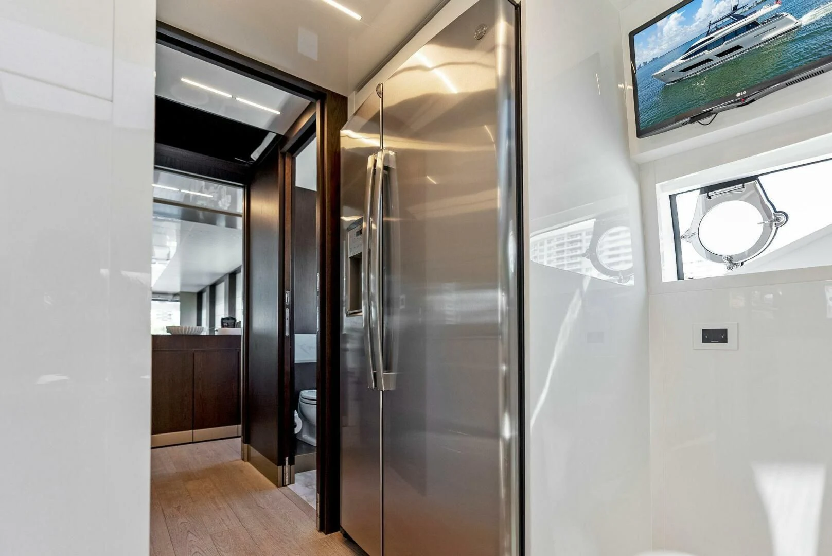 a hallway with glass doors aboard INEA Yacht for Sale