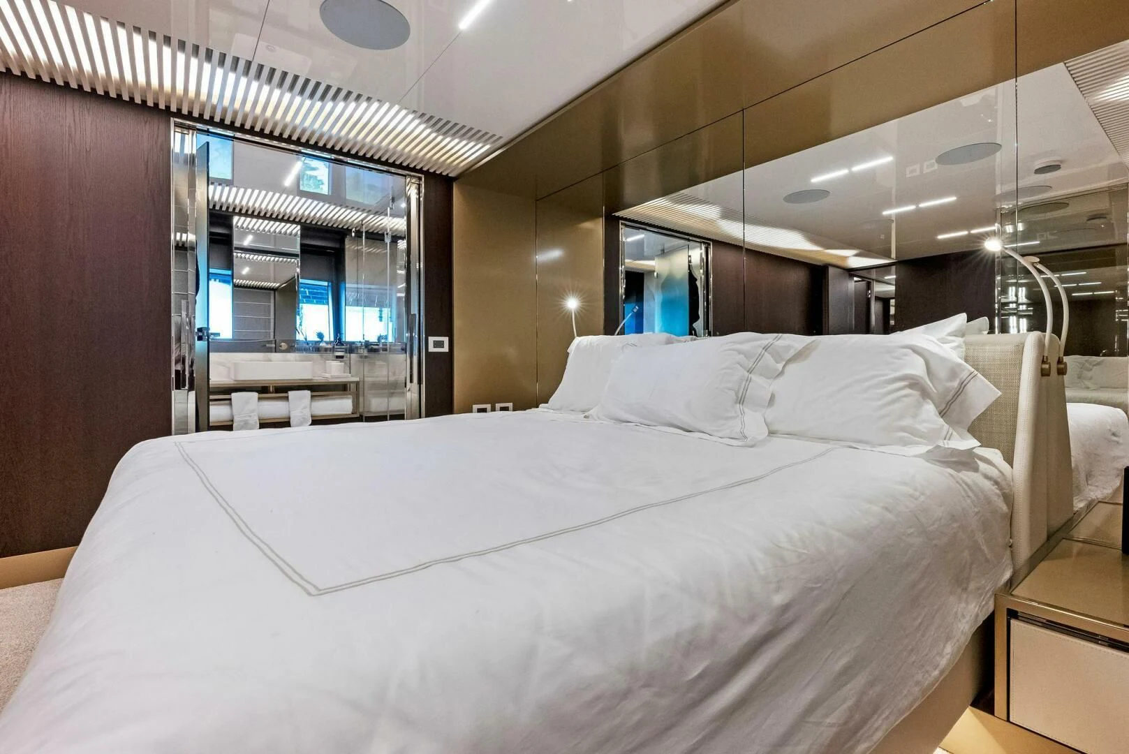 a bed with white sheets aboard INEA Yacht for Sale
