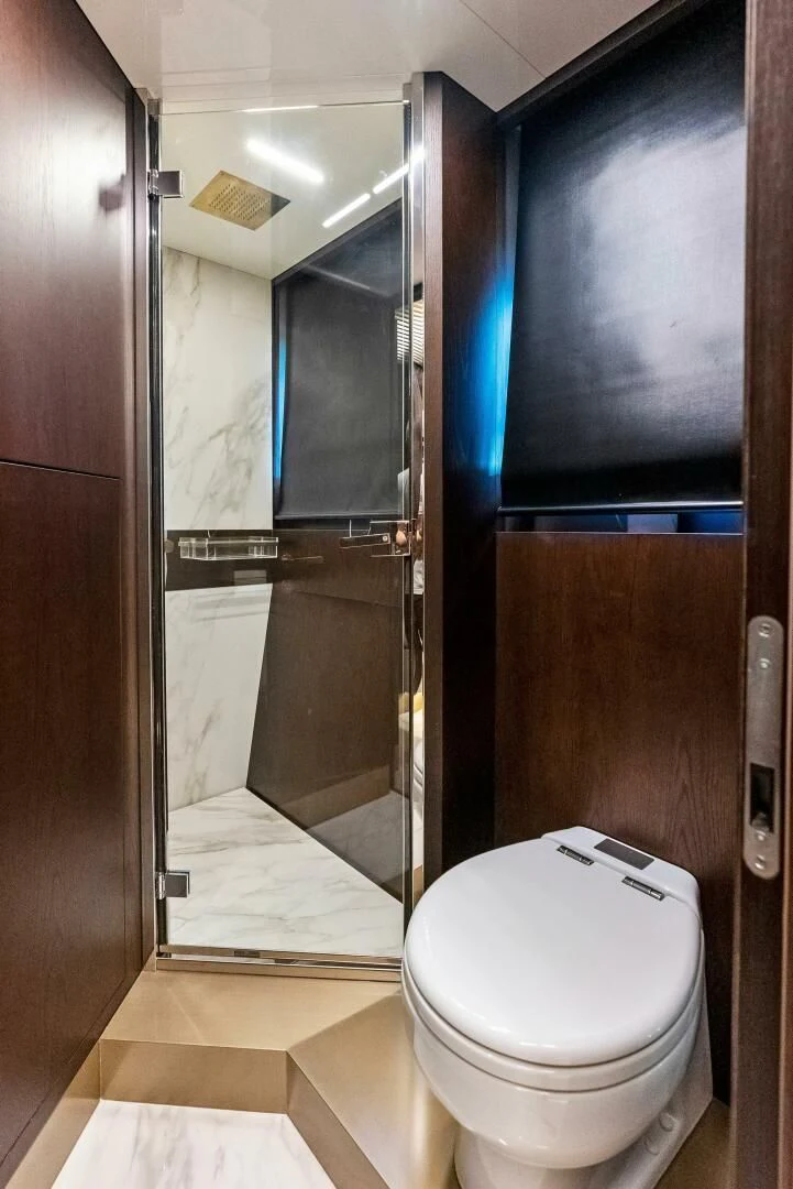 a bathroom with a glass shower aboard INEA Yacht for Sale