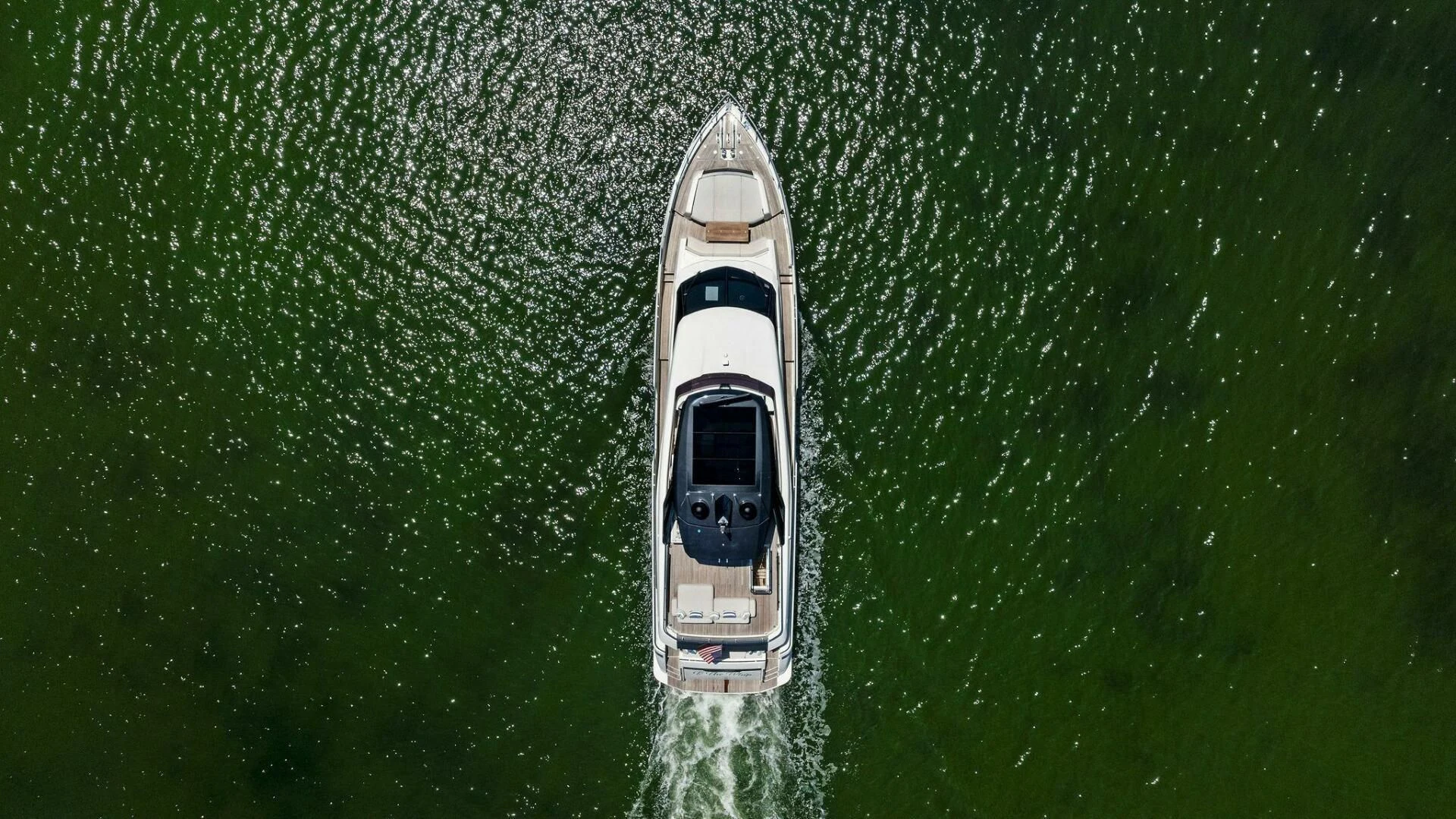 a white car in the water aboard INEA Yacht for Sale