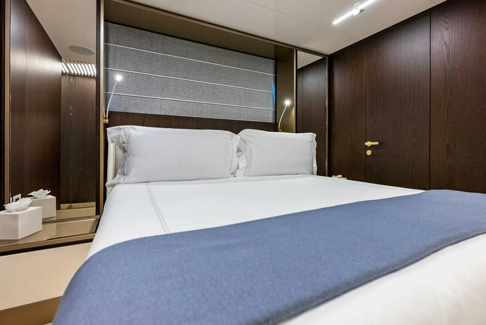 a bed with white sheets aboard INEA Yacht for Sale