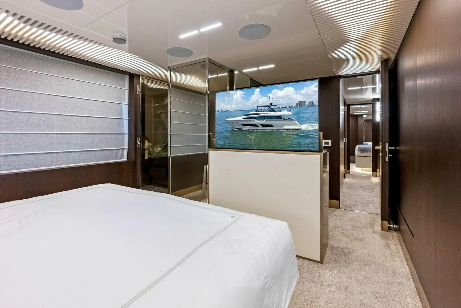 a room with a bed and a television aboard INEA Yacht for Sale
