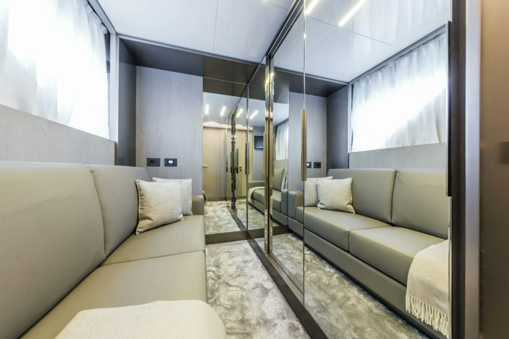 a living room with a large mirror aboard INEA Yacht for Sale